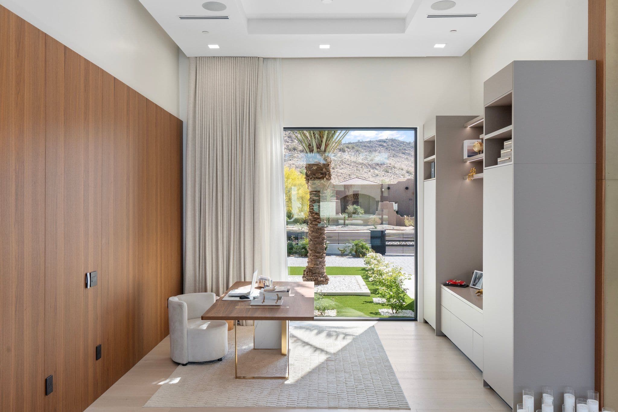 Minimalist home office with modern furnishings and natural light, featured in the Modern Desert Oasis collection for a productive workspace.